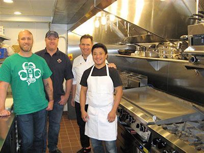 Owners (from left) Steve Mars and Scott Mars with Jack Reibel and head chef Billy Ring in the Paddy Shack kitchen. Photo for Park Bugle by Roger Bergerson.